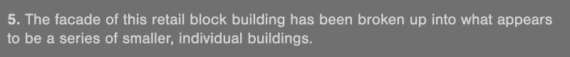 5  The facade of this retail block building has been broken up into what appears to be a series of smaller, individua   
